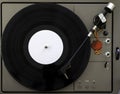 Turntable vinyl record player on the background white wooden boards. Royalty Free Stock Photo