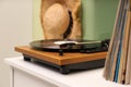 Turntable with vinyl record on white table indoors, space for text Royalty Free Stock Photo