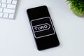 Turo app logo on a smartphone screen.