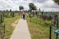 Turov, Belarus - August 7, 2016: place of worship pilgrims growing stone cross in a cemetery in the town of Turov, Belarus.