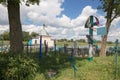 Turov, Belarus - August 7, 2016: place of worship pilgrims growing stone cross in a cemetery in the town of Turov, Belarus.