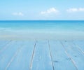 Turquoise background collage of wooden planks and blurred tropical seascape