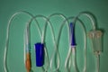 Turquoise Background, Medical Dropper, Medical Plastic Intravenous System. Close-up of the Central Venous Conduit. Medical