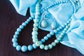 Turquoise bead on a wooden