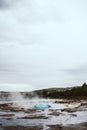 The turquoise blue boiling bubble and white steam of the famous Strokkur Geyser In Iceland Royalty Free Stock Photo