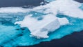Turquoise blue glacier ice floats in the Arctic Ocean Royalty Free Stock Photo