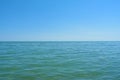 Turquoise blue sea horizon, clear sky