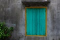 Turquoise blue wooden shutter on a window of a rural home in northern Vietnam Royalty Free Stock Photo