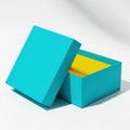 Turquoise box with yellow interior on white surface Royalty Free Stock Photo