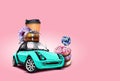 Turquoise car on pink background. Donuts, candy canes, coffee, cookies, chocolate macarons on the roof of it. Collage