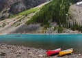 Turquoise color Moraine Lake with red and yellow canoe in Banff national park, located in Canadian Rockies in Alberta Canada Royalty Free Stock Photo