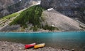 Turquoise color Moraine Lake with red and yellow canoe in Banff national park, located in Canadian Rockies in Alberta Canada Royalty Free Stock Photo