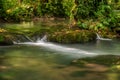 Turquoise color of water in the summer on the river Janj Royalty Free Stock Photo