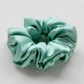 Silk Scrunchy isolated on white. Flat lay Hairdressing tools and accessoriesas Color Hair Scrunchies, Elastic Hair Bands, Bobble Royalty Free Stock Photo