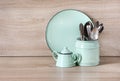 Turquoise crockery, tableware, dishware utensils and stuff on wooden table-top. Kitchen still life as background for design. Royalty Free Stock Photo