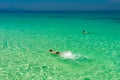 Turquoise crystal clear sea with man do snorkeling in water near