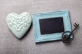 Turquoise decorative heart, vintage key and empty blackboard on Royalty Free Stock Photo