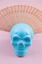 Turquoise decorative sugar scull over the pastel background. Halloween decoration. Sceleton head for the Day of dead Royalty Free Stock Photo