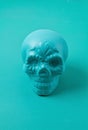 Turquoise decorative sugar scull over the pastel background. Halloween decoration. Sceleton head for the Day of dead Royalty Free Stock Photo