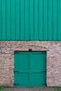 Turquoise doors under wooden turquoise boards Royalty Free Stock Photo