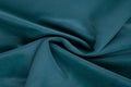 Turquoise fabric texture - close-up of a piece of crushed and twisted turquoise velvet Royalty Free Stock Photo