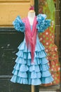 Turquoise flamenco dress is displayed in Centro old district of Sevilla Spain Royalty Free Stock Photo