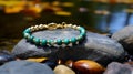 Turquoise And Gold Beaded Bracelet On Rocks - Nikon D750 Photo Royalty Free Stock Photo