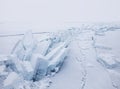 Turquoise ice floe. Ice-drift of Baikal lake. Winter landscape.