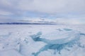 Turquoise ice floe. Winter landscape. Ice-drift. Baikal lake