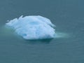 A Turquoise Iceberg Floating on Sea Royalty Free Stock Photo
