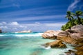 Turquoise Indian Ocean coconut palms and rocks in the Seychelles islands