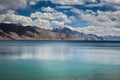 Turquoise lake in the Himalayas tibet mountains with clouds and blue sky Royalty Free Stock Photo