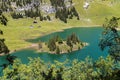 The turquoise Lake Hinterstocken with the islet at the foot of Stockhorn peak