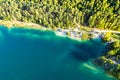 Turquoise lake near coniferous forest in mountains, aerial landscape. Hiking concept. Health habits Royalty Free Stock Photo