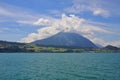 Turquoise lake Thunersee and Mt Niesen Royalty Free Stock Photo