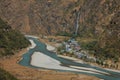 Turquoise Marsyangdi river and village Tal Royalty Free Stock Photo