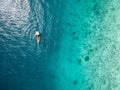 Turquoise ocean water with boat on it top view Royalty Free Stock Photo