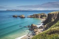 Turquoise ocean water washing Irish shore. Royalty Free Stock Photo