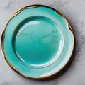 Turquoise plate porcelain with gold border on marble table. Empty dishes. Modern utensils. View from above. Top view of empty Royalty Free Stock Photo