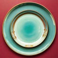 Turquoise plate porcelain with gold border on red table. Empty dishes. Modern utensils. View from above. Top view of empty saucer Royalty Free Stock Photo