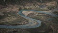 Turquoise river bends through landscape of Jotunheimen National Park in Norway