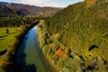 Turquoise river flowing through forested landscape Royalty Free Stock Photo