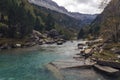 Turquoise river between forests and mountains in the Ordesa Valley, Pyrenees. Rio Arazas Royalty Free Stock Photo