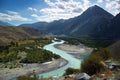 Turquoise river, mountains and skies Royalty Free Stock Photo