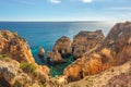 Turquoise sea bay among rocks and cliffs at Ponta da Piedade near Lagos, Algarve region, Portugal Royalty Free Stock Photo