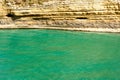 Turquoise sea with cliffs