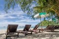 Turquoise sea, deckchairs, white sand and palms, sun, Summer