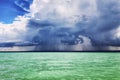 Turquoise sea and dramatic dark sky with clouds, beautiful landscape Royalty Free Stock Photo