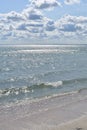 Turquoise sea golden sand, blue sea and clouds like wool white hanging in blue sky, dream beach, azure coast, empty beach, end of Royalty Free Stock Photo