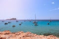 Turquoise sea under the bright summer sun of Ibiza, Cala Comte. Balearic Islands, Spain Royalty Free Stock Photo